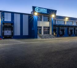 Illuminated Varna Stock facade and loading docks at night